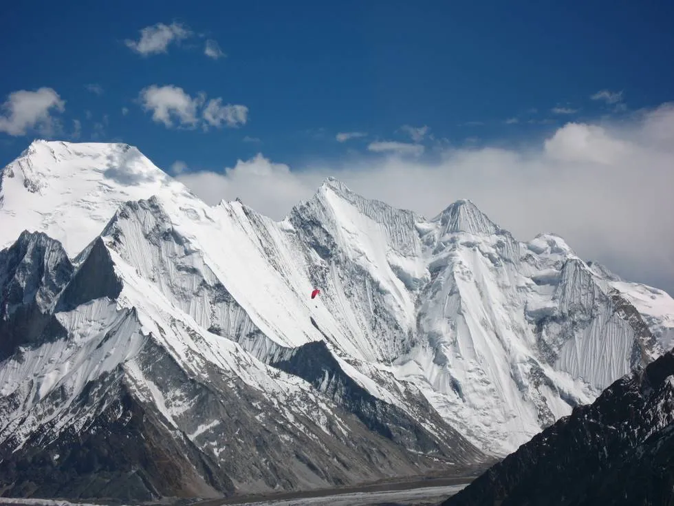 Paraglider against the mountains