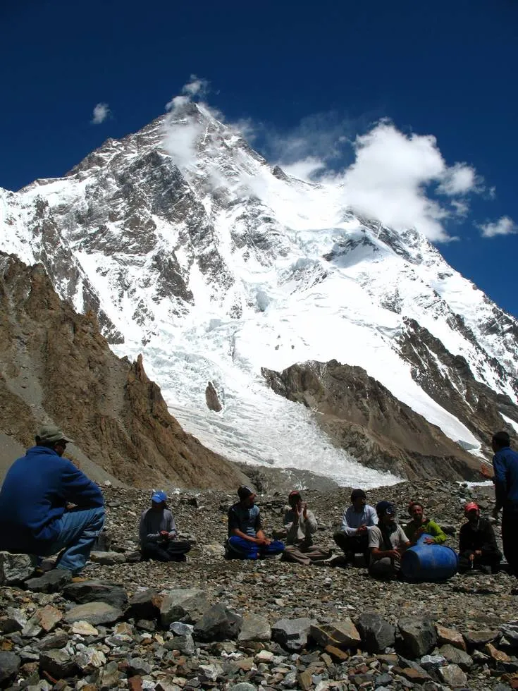 Khiz playing the drum with one heck of a majestic backdrop