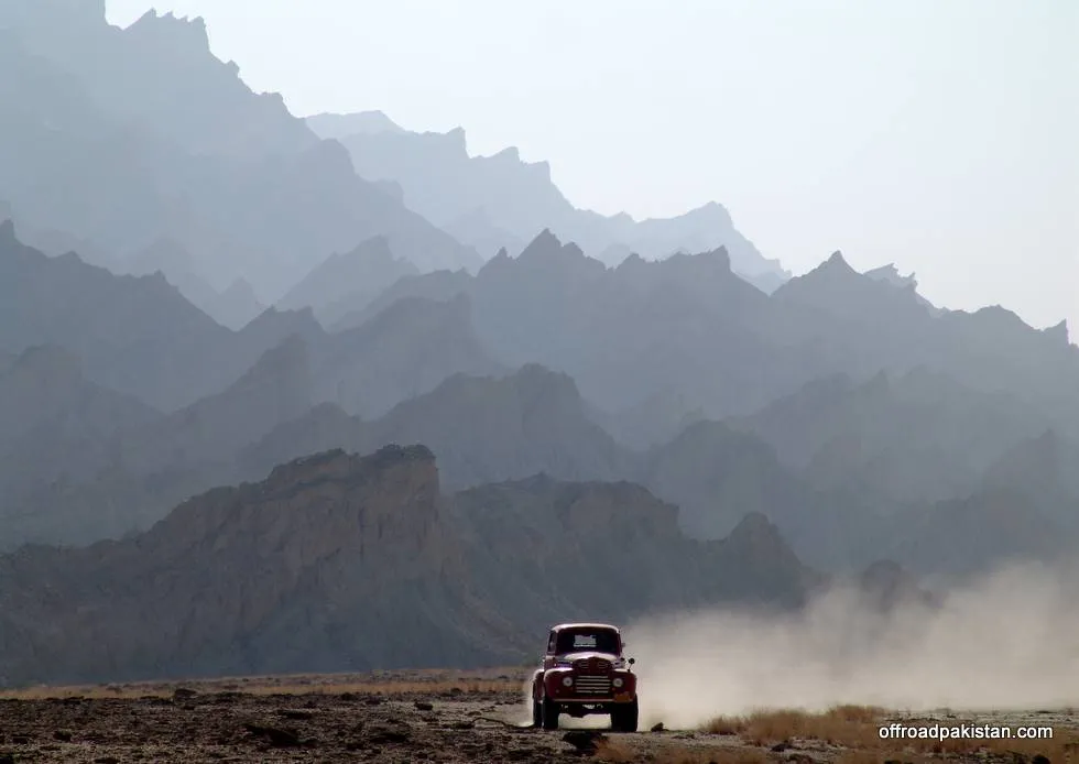 The mountain ranges fading away in the background.