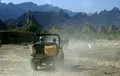 KO's white jeep heading towards Goran.