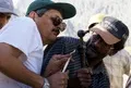 Hamid Omar guides the mechanic on how repairs are really done.