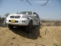 1st day 1st vehicle stuck!  The Prado had one front and one rear wheel in the air  - had to be  winched out!