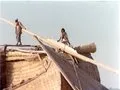 Closeup of a river boat carrying fodder
